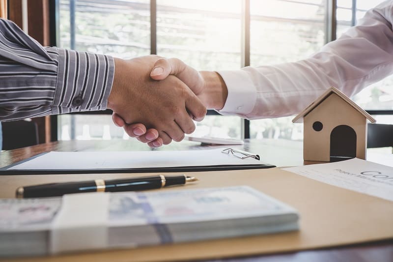 handshake over table